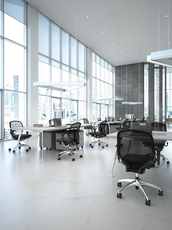 Refurbished work space with workbench and task chairs with LED lighting in roof.